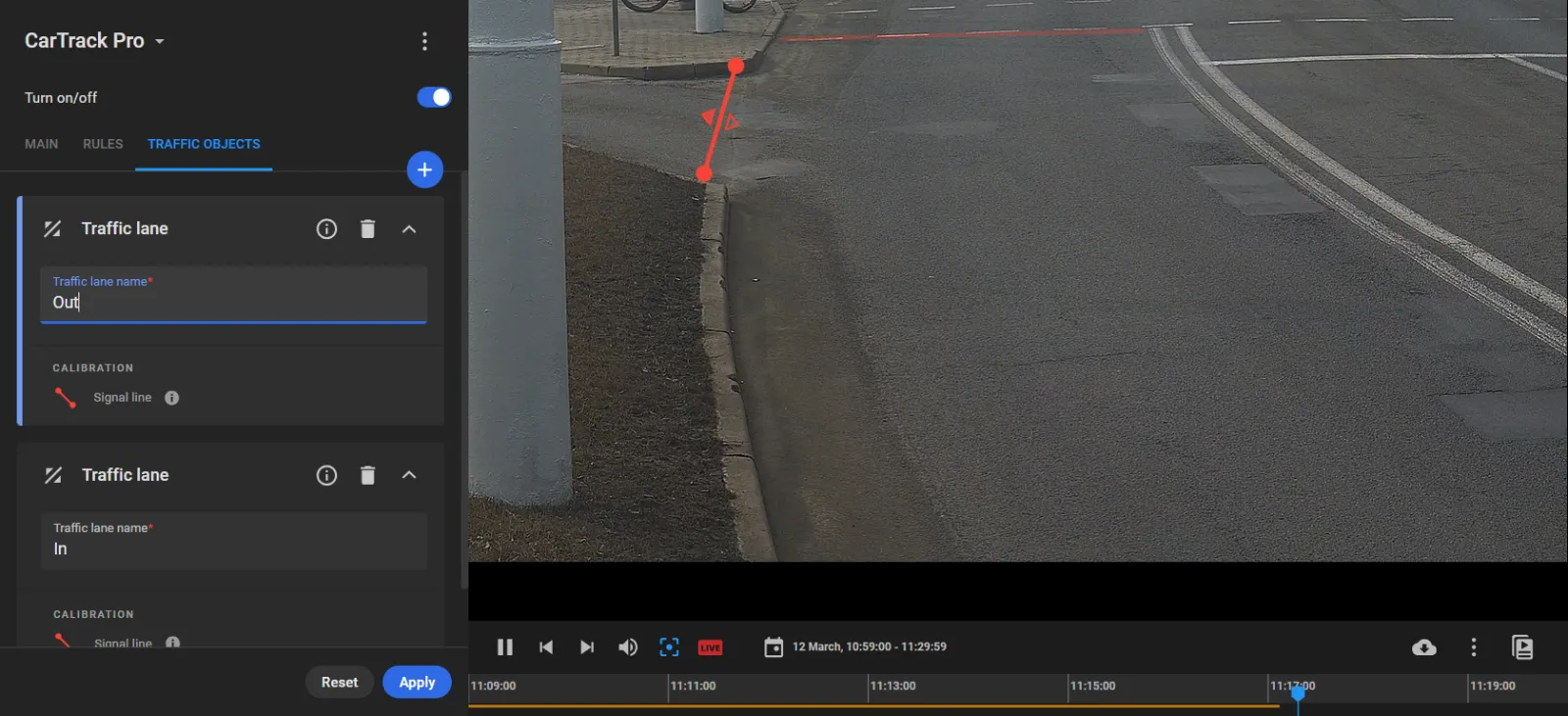 CarTrack Pro Traffic Objects tab with a red exit lane line drawn near the curb with direction triangles, and Out and In traffic lanes listed on the left