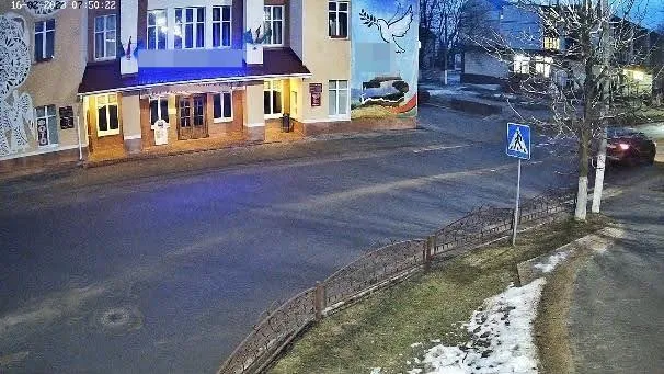 Bad camera mount example: low-angle night street view with no vehicle close enough to capture a readable plate