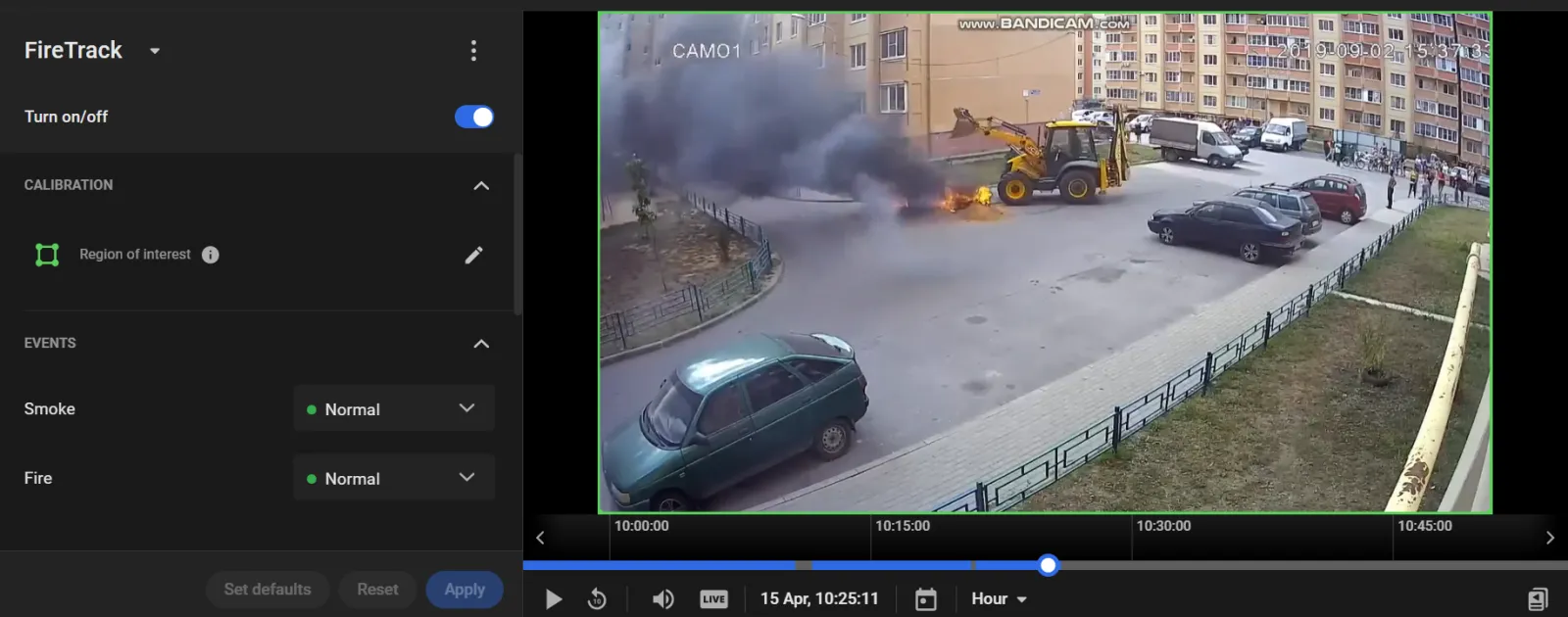 FireTrack settings panel next to a camera view of a burning car with smoke, with Smoke and Fire event severity both set to Normal