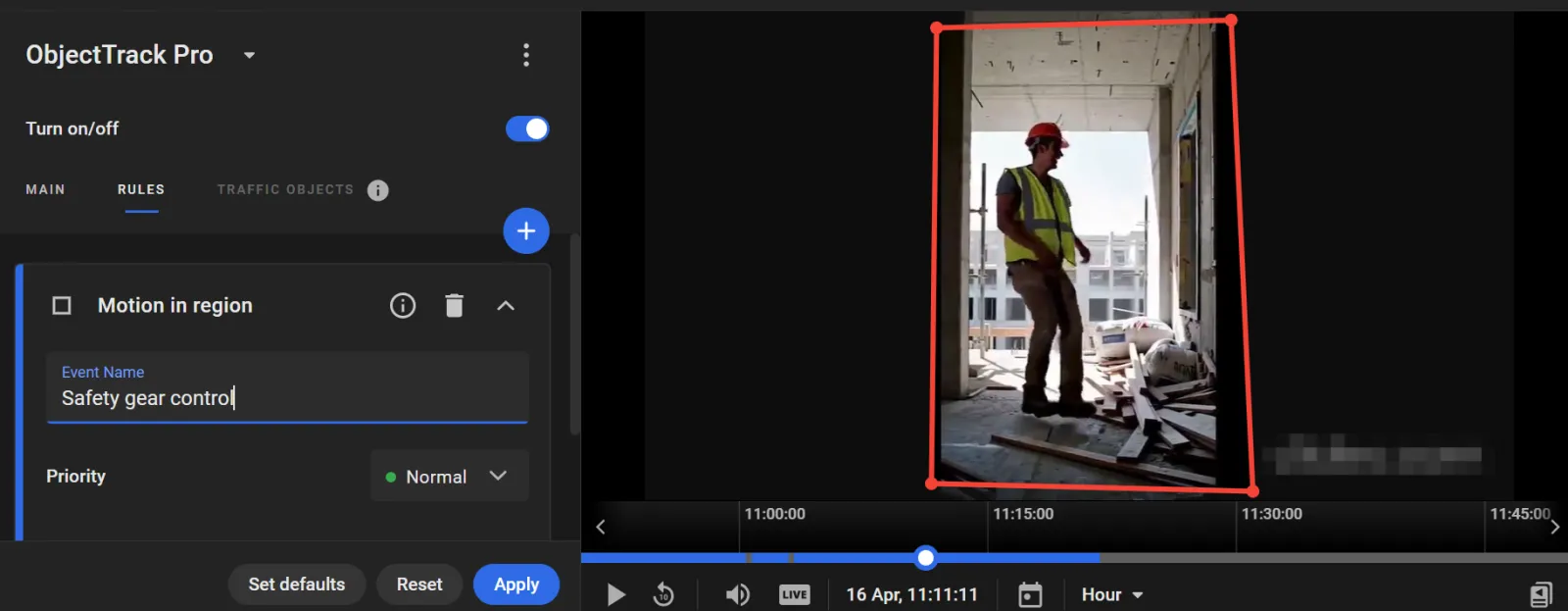 Motion in region rule named Safety gear control, over a construction site camera feed with a worker in a hard hat and safety vest boxed in the frame