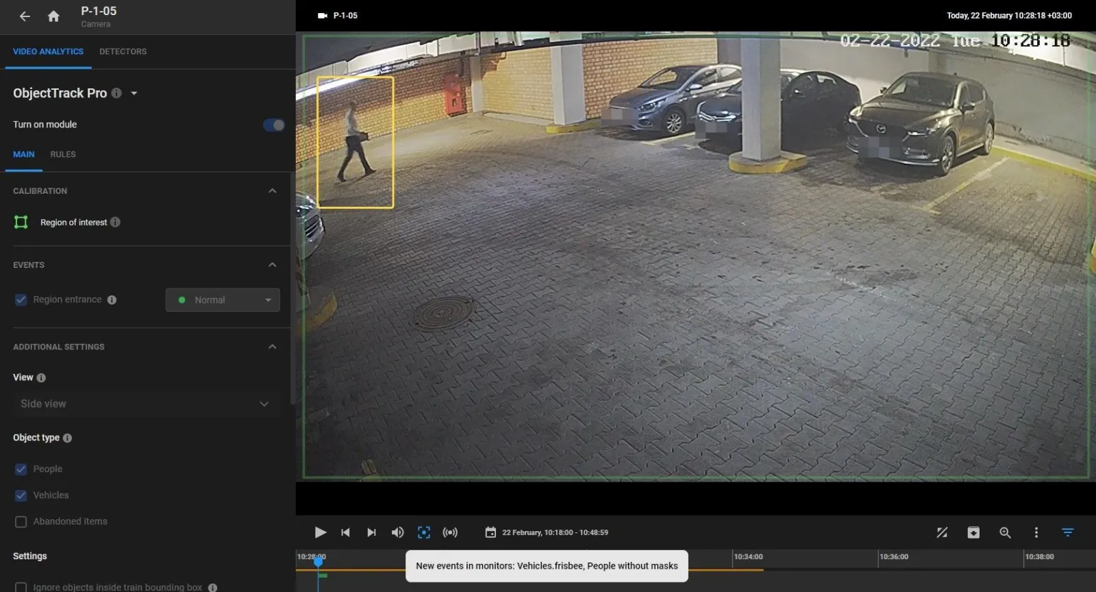 Region entrance event enabled over a parking garage camera feed with a person boxed inside the region of interest